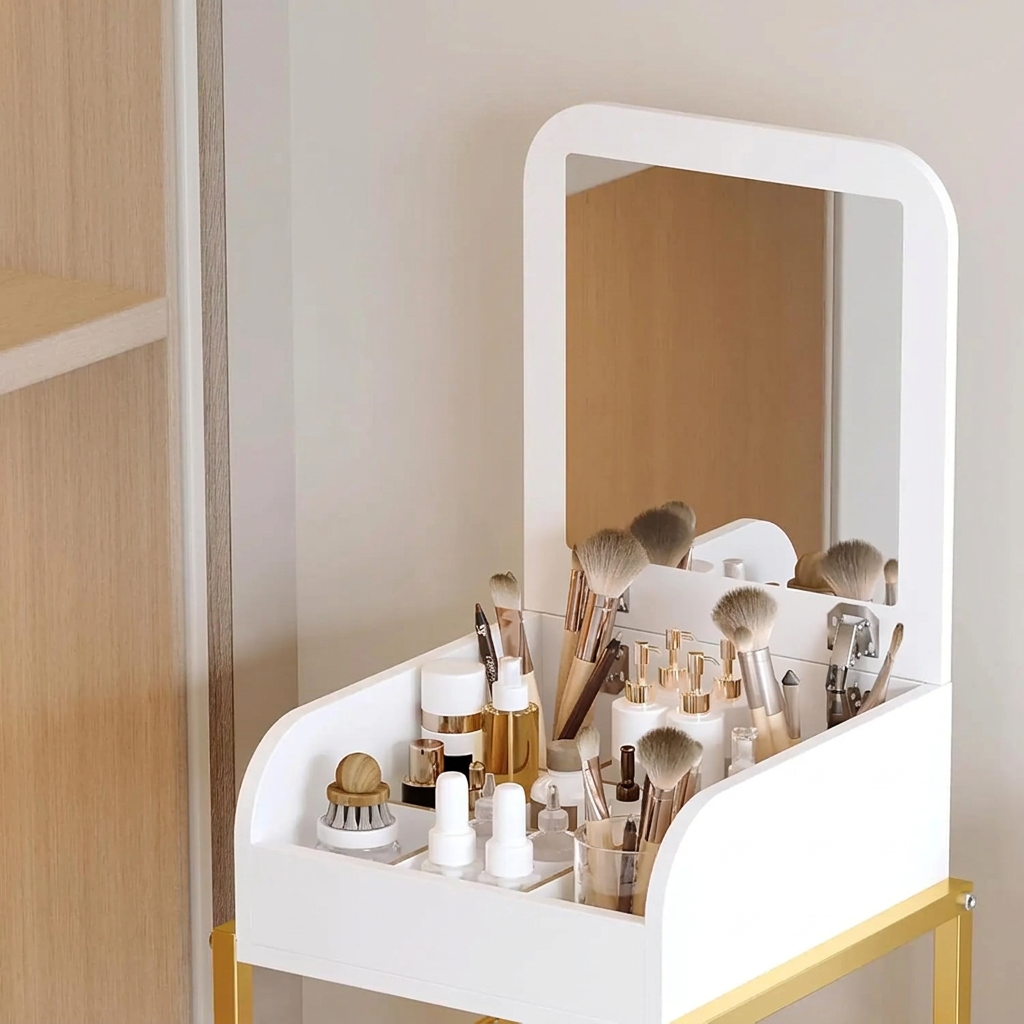 Close-up of the lift-top mirror and brush storage on the white and gold makeup cart